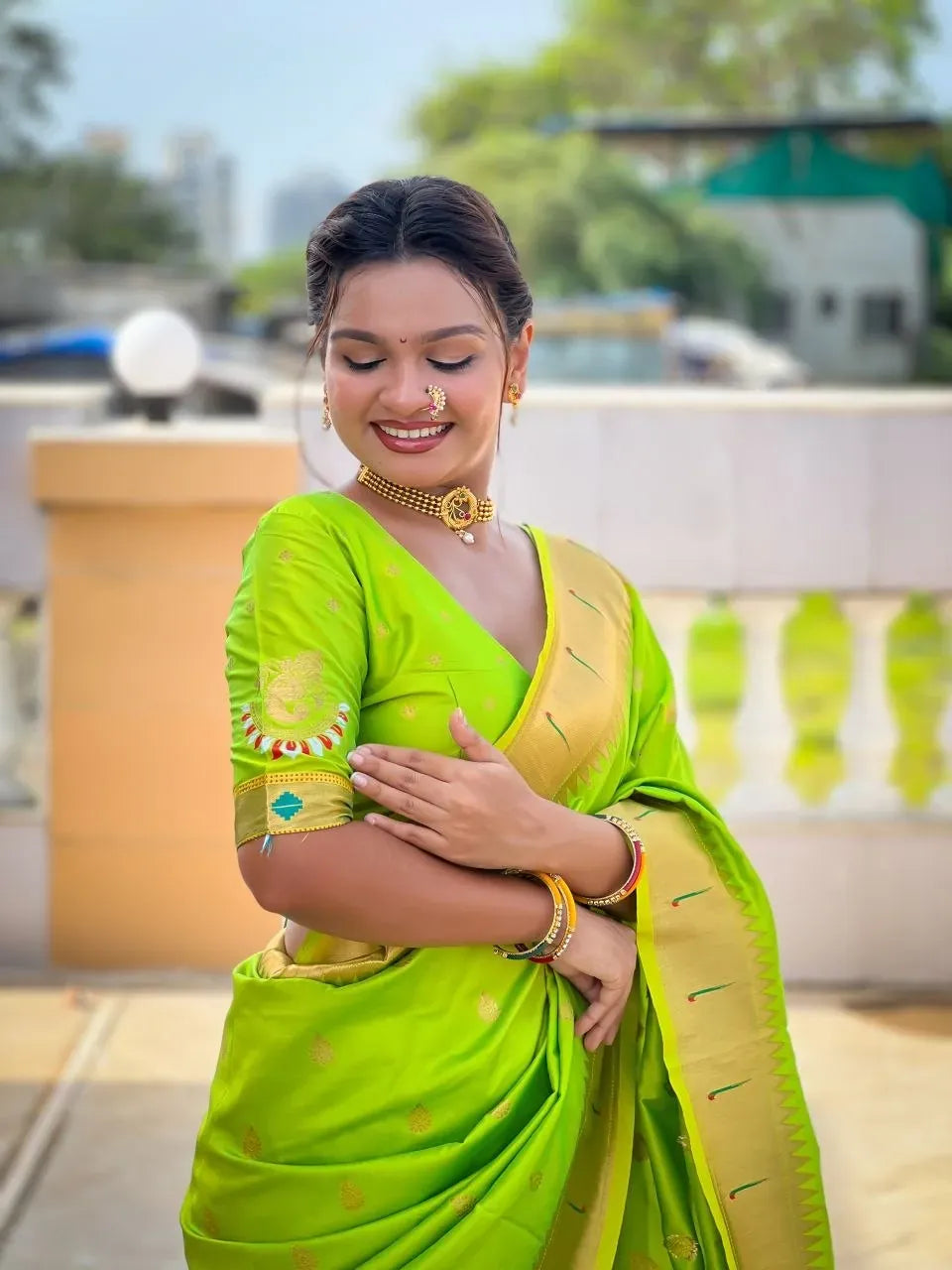 Model wearing neon green soft paithani silk saree with rich zari border