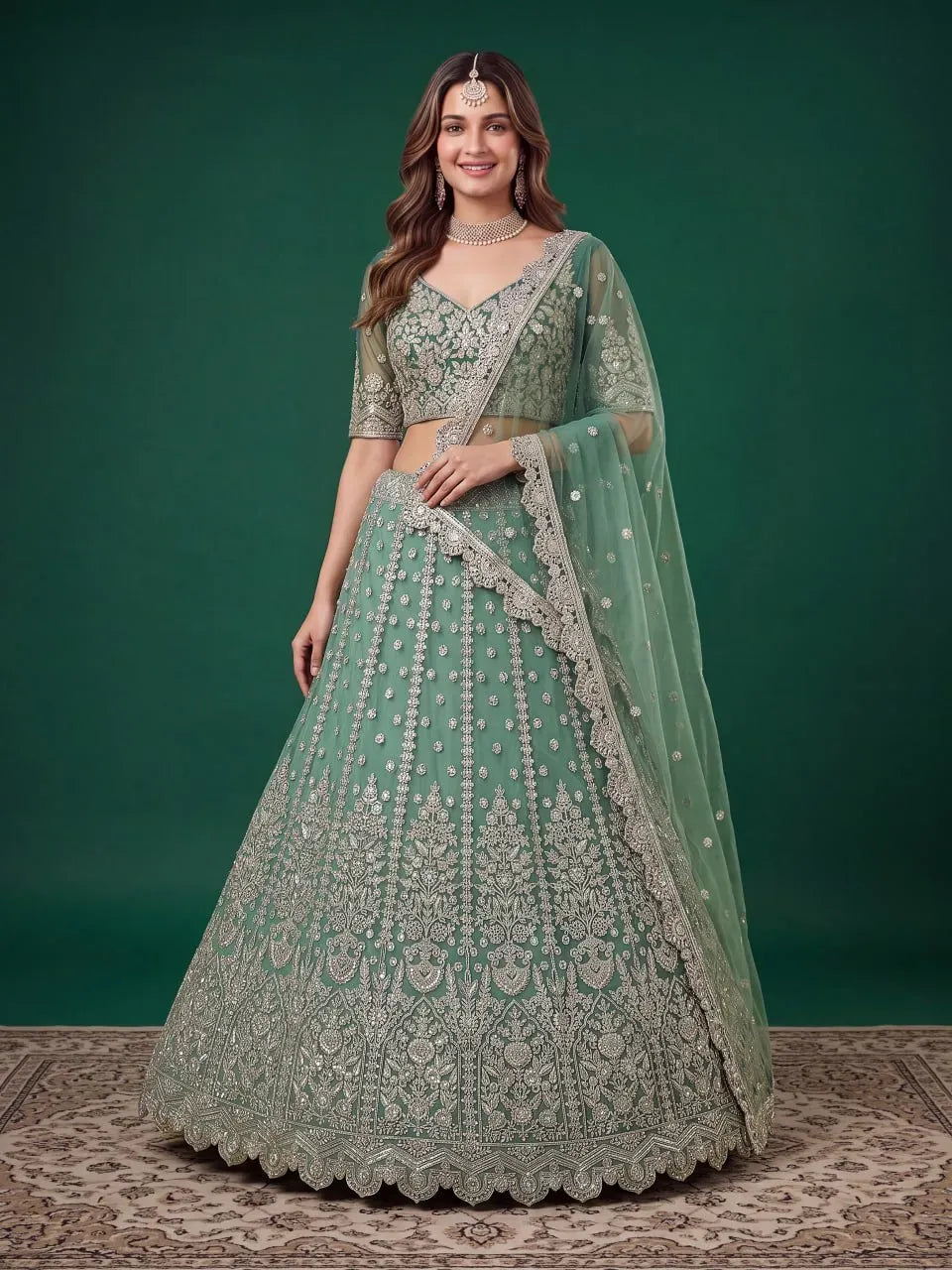 Model wearing pista green embroidered lehenga choli front view
