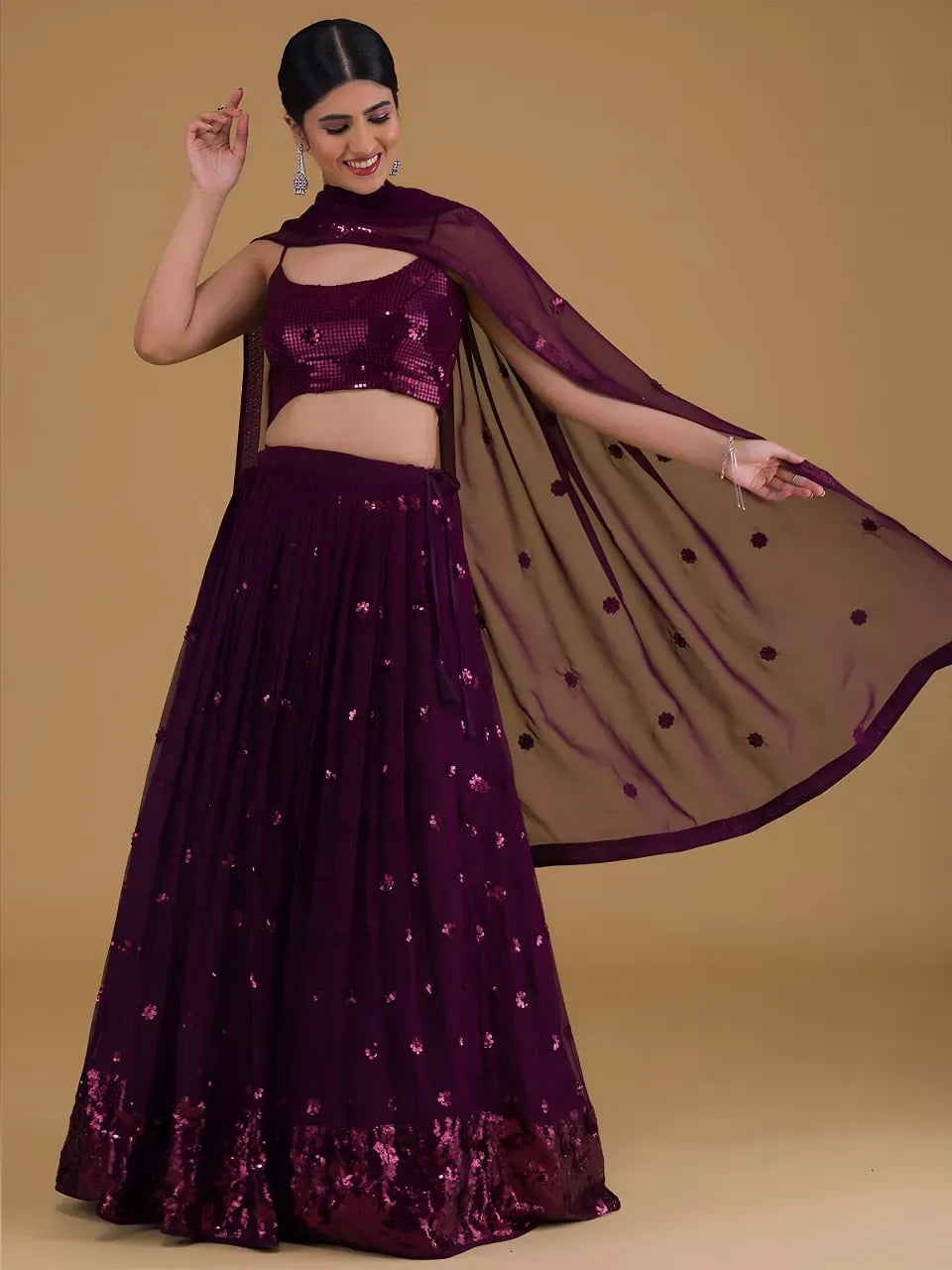 Front-facing full-body view of model wearing plum purple sequin lehenga and dupatta