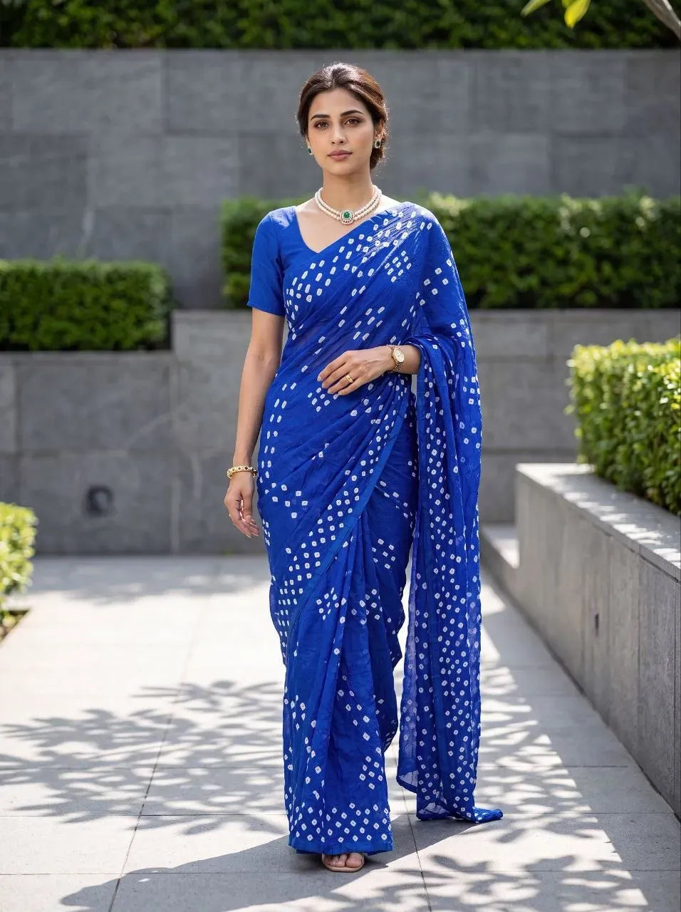 Model wearing royal blue pure silk bandhani saree with running blouse