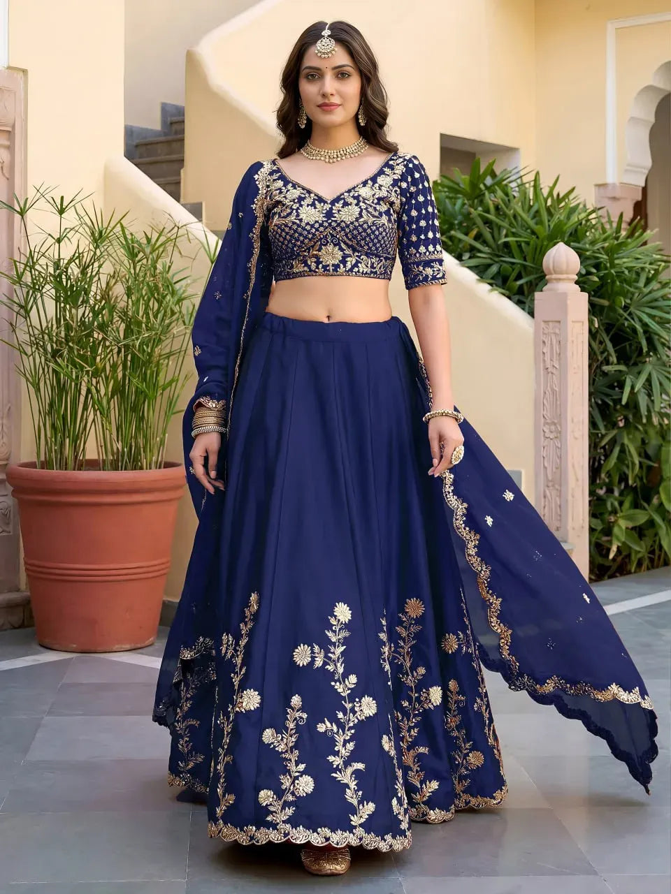 Model standing straight in royal blue party wear lehenga choli