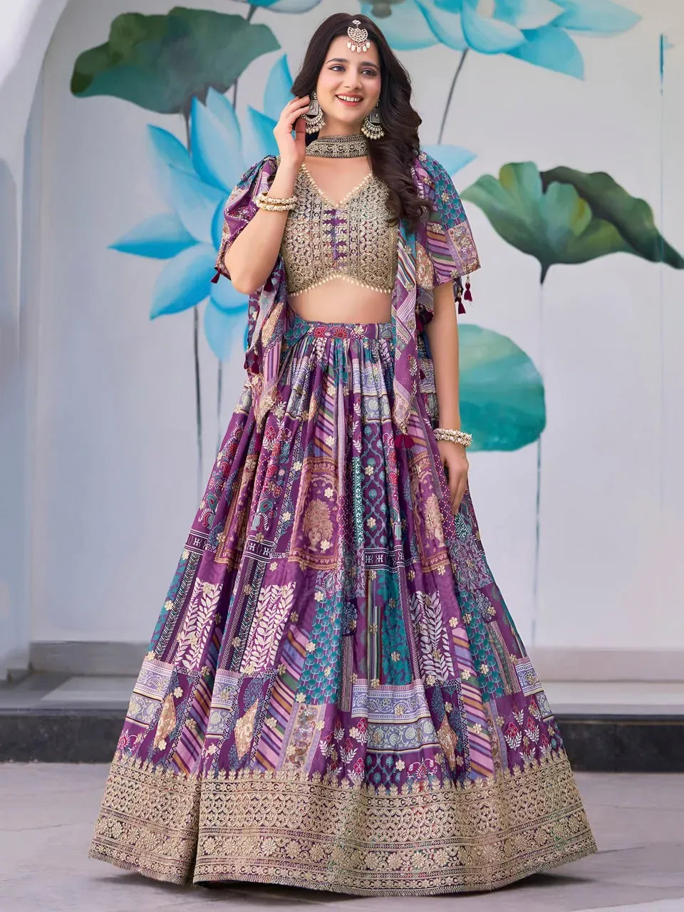 Model wearing royal purple digital printed designer lehenga choli with heavy embroidery