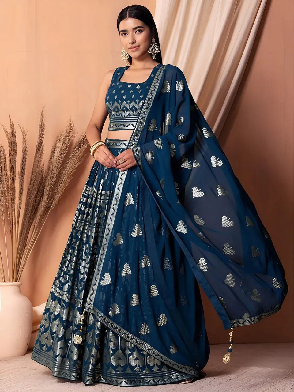 Model wearing royal sapphire blue sequin designer lehenga choli with dupatta