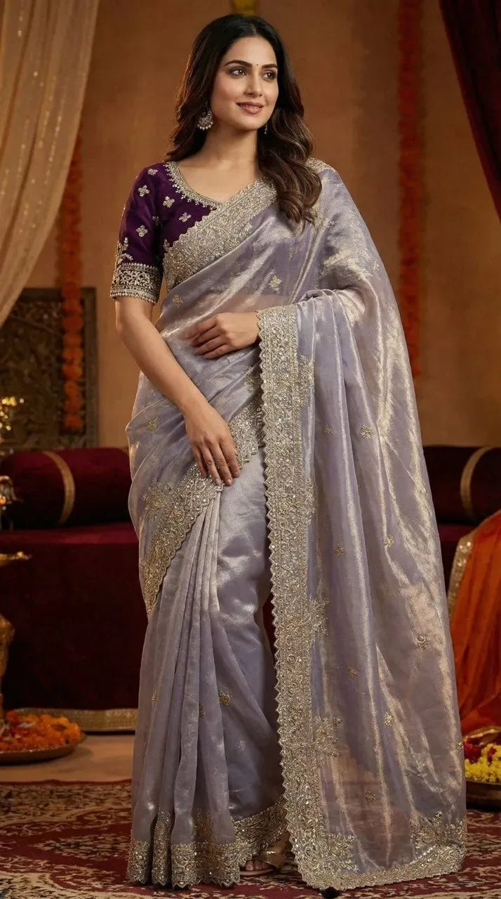 Model wearing lavender satin silk saree with embroidered purple blouse