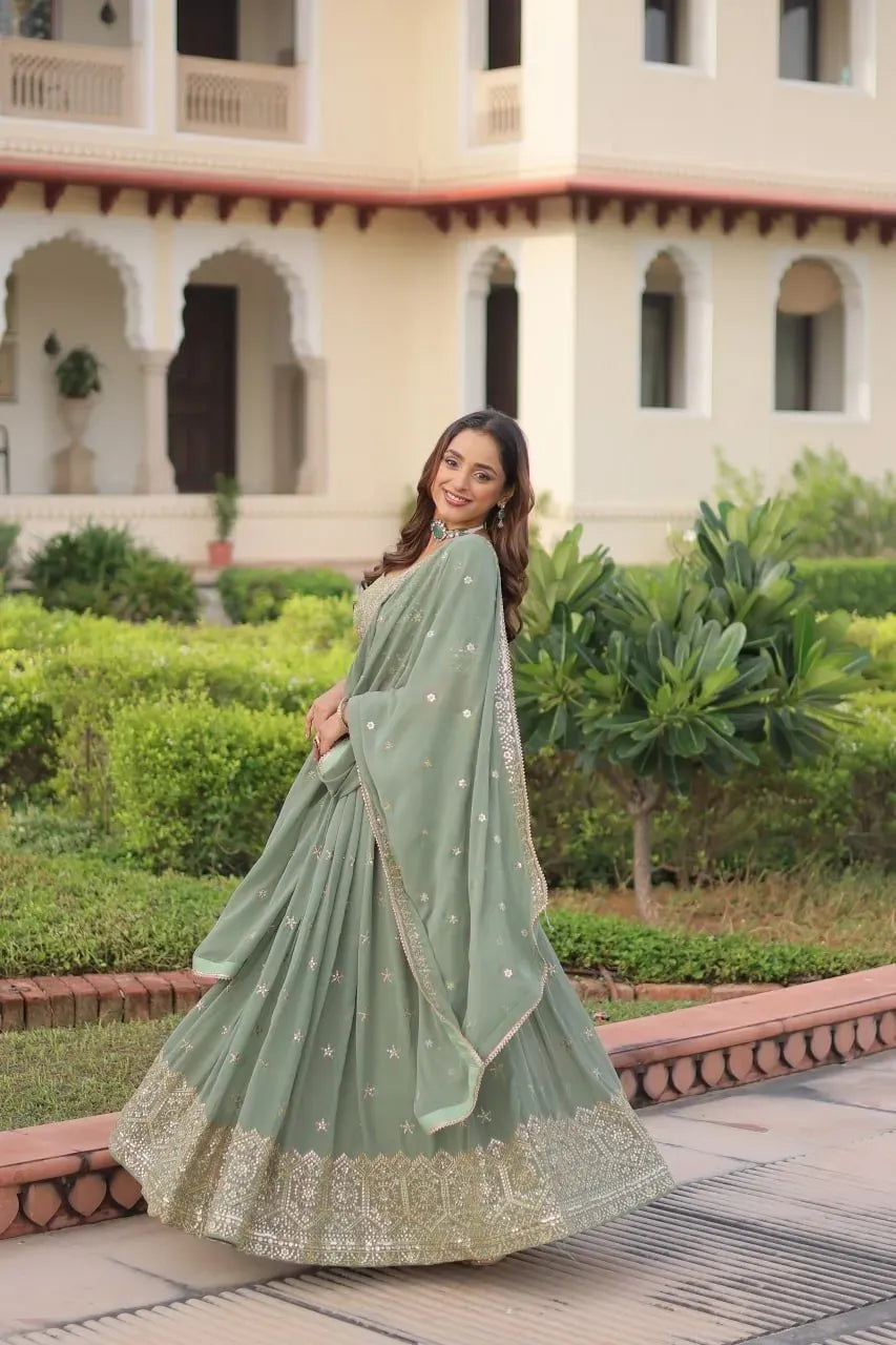 Model wearing sea green georgette lehenga choli outdoors