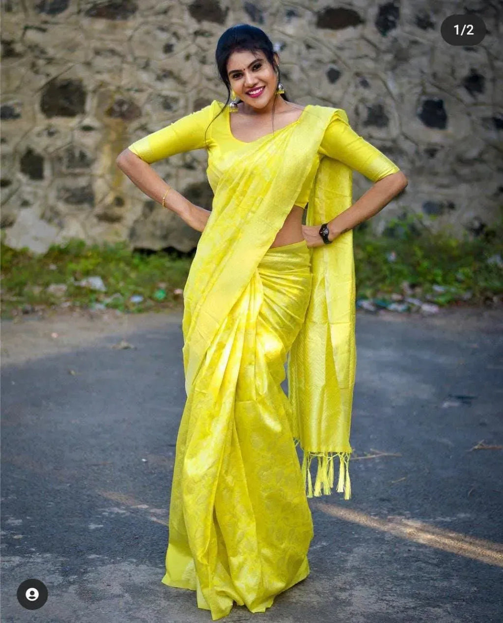 Full body shot of woman in bright yellow traditional kurti set outdoors