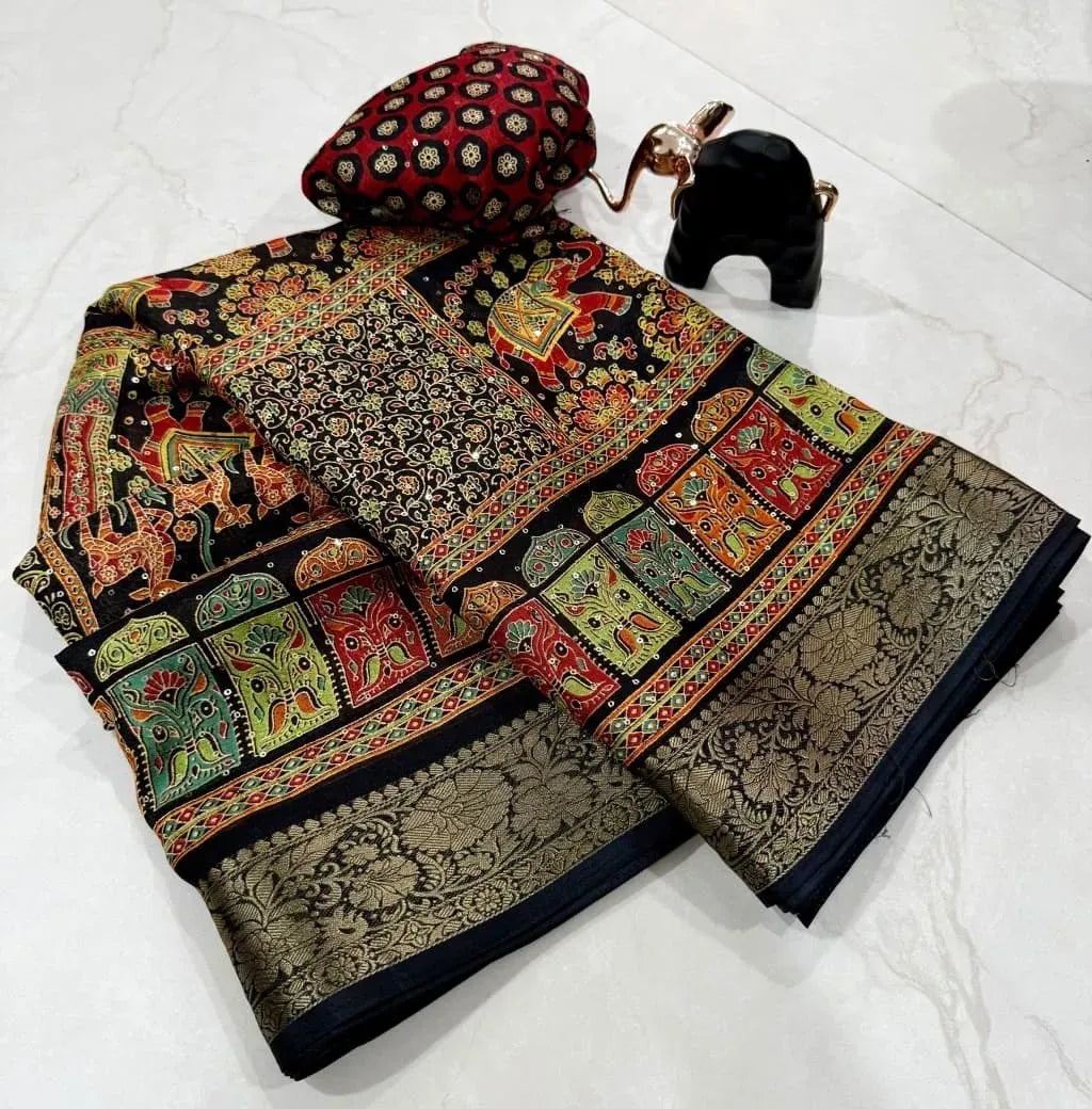 Folded black silk saree with colourful ethnic prints and gold border
