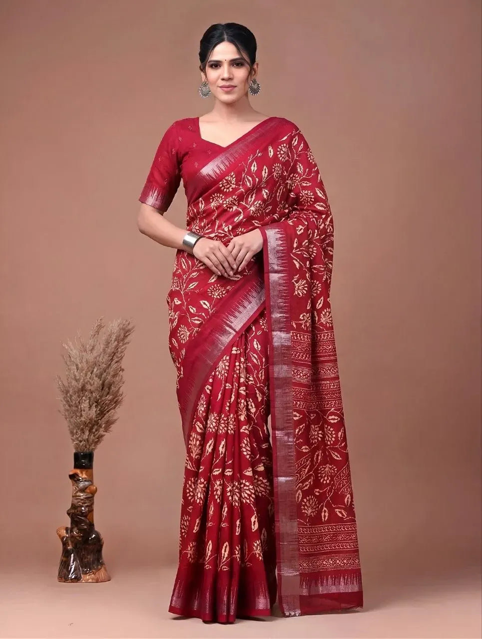 Full body shot of model in cherry red slub silk saree