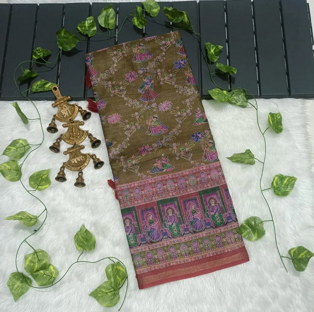 Folded olive green soft cotton saree with intricate print and decorative bells