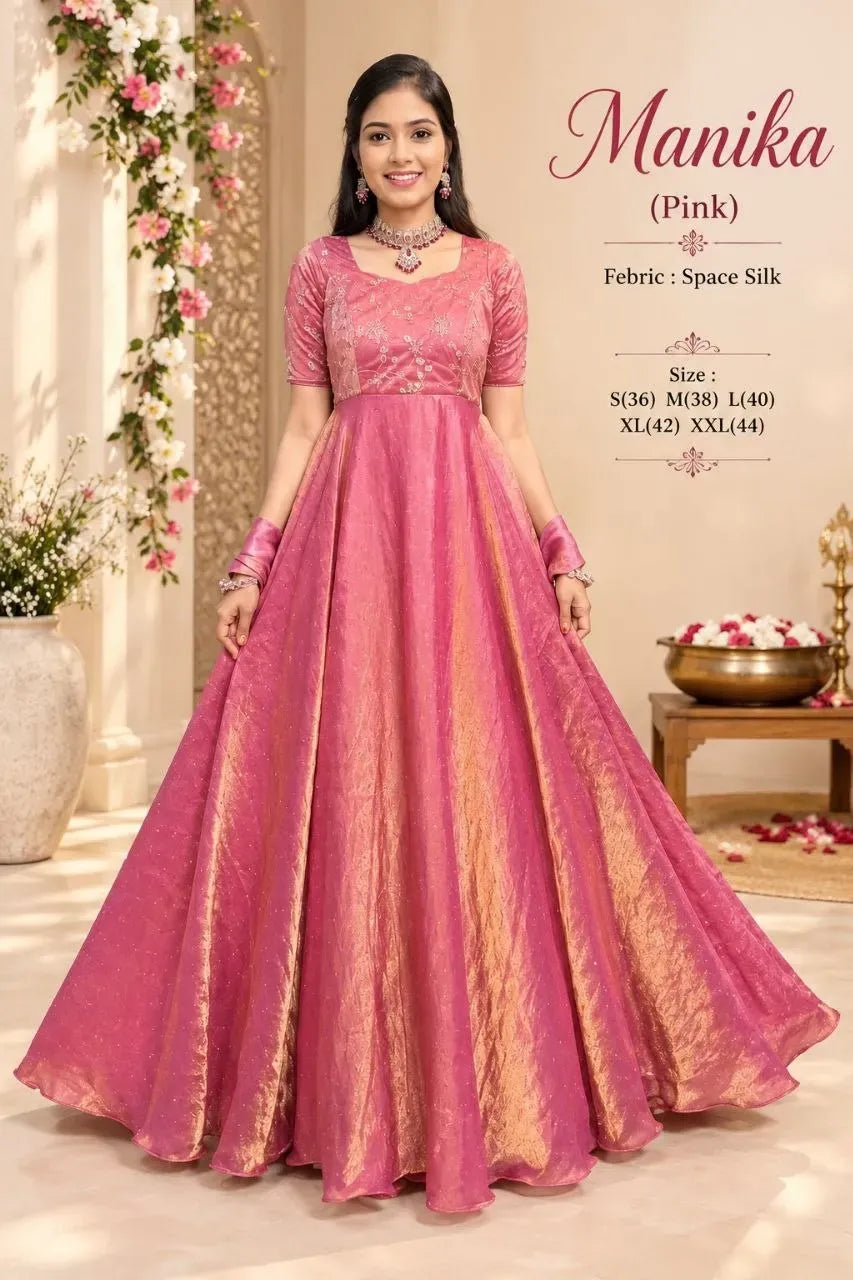Model wearing pink space silk anarkali with embroidery and matching dupatta