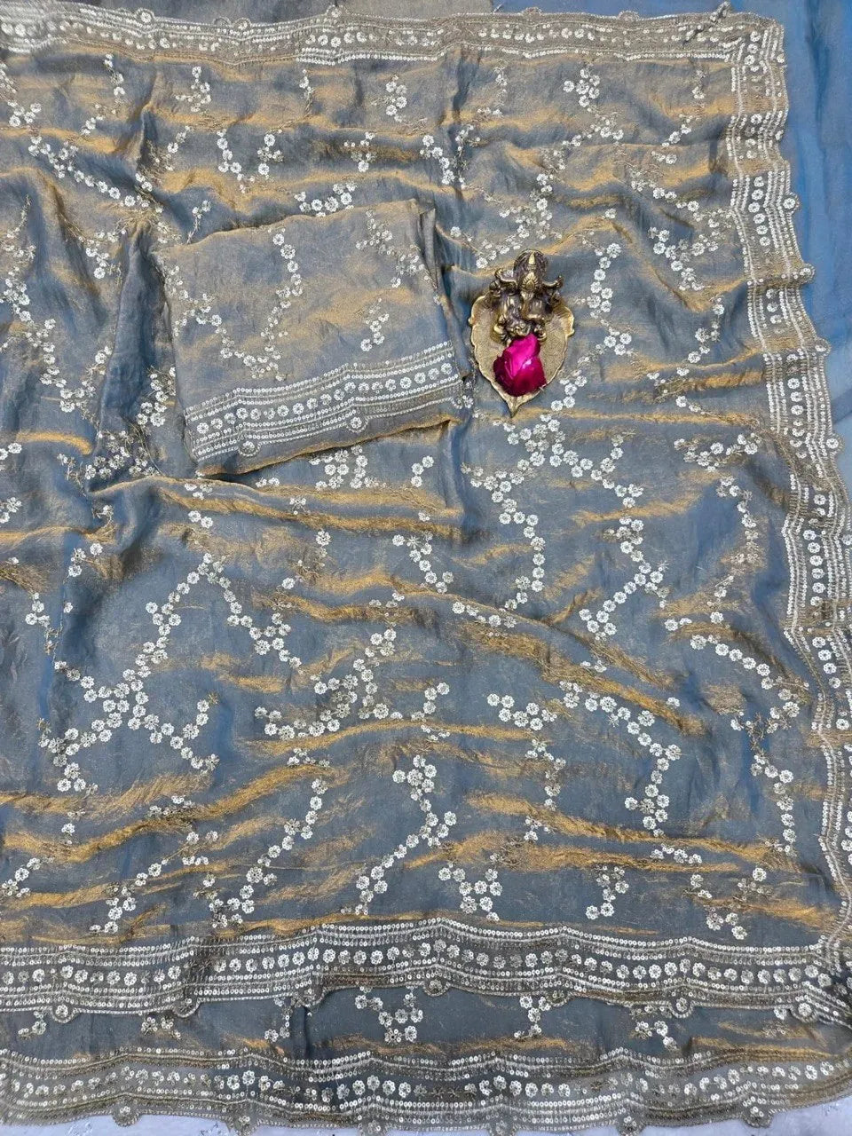 Grey space silk saree with sequence work and folded blouse piece