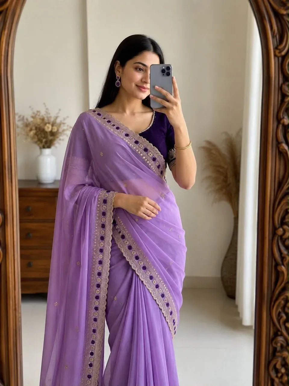 Model wearing lavender star georgette saree with embroidery