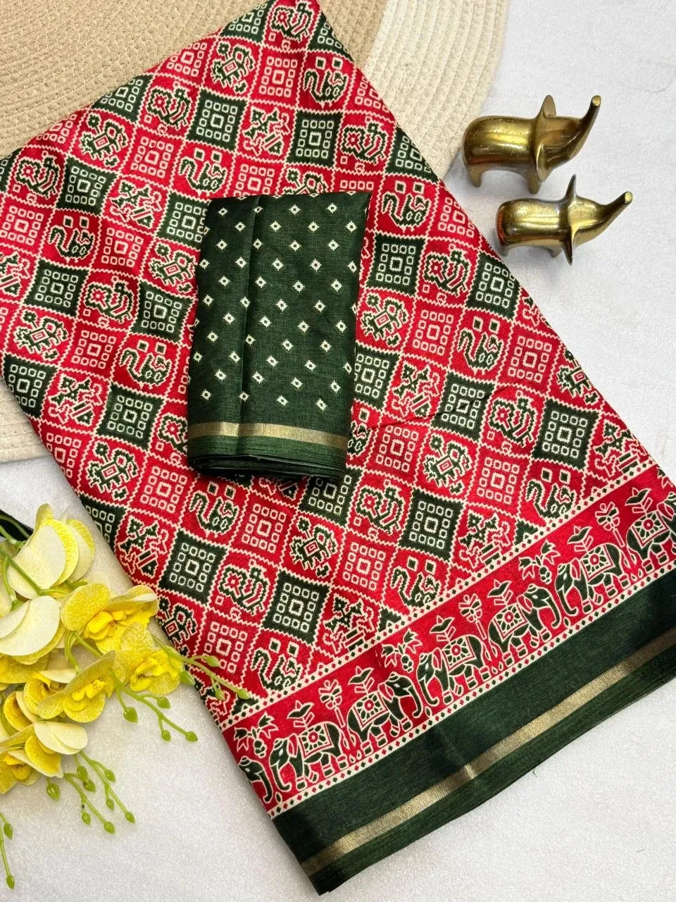 Red and green Tasva silk saree with Patola print and zari border
