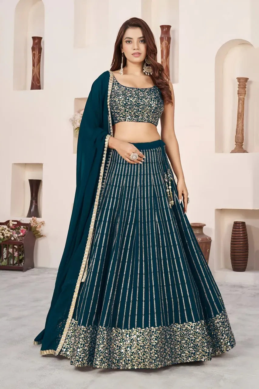 Front view of woman wearing teal green sequins lehenga choli with dupatta