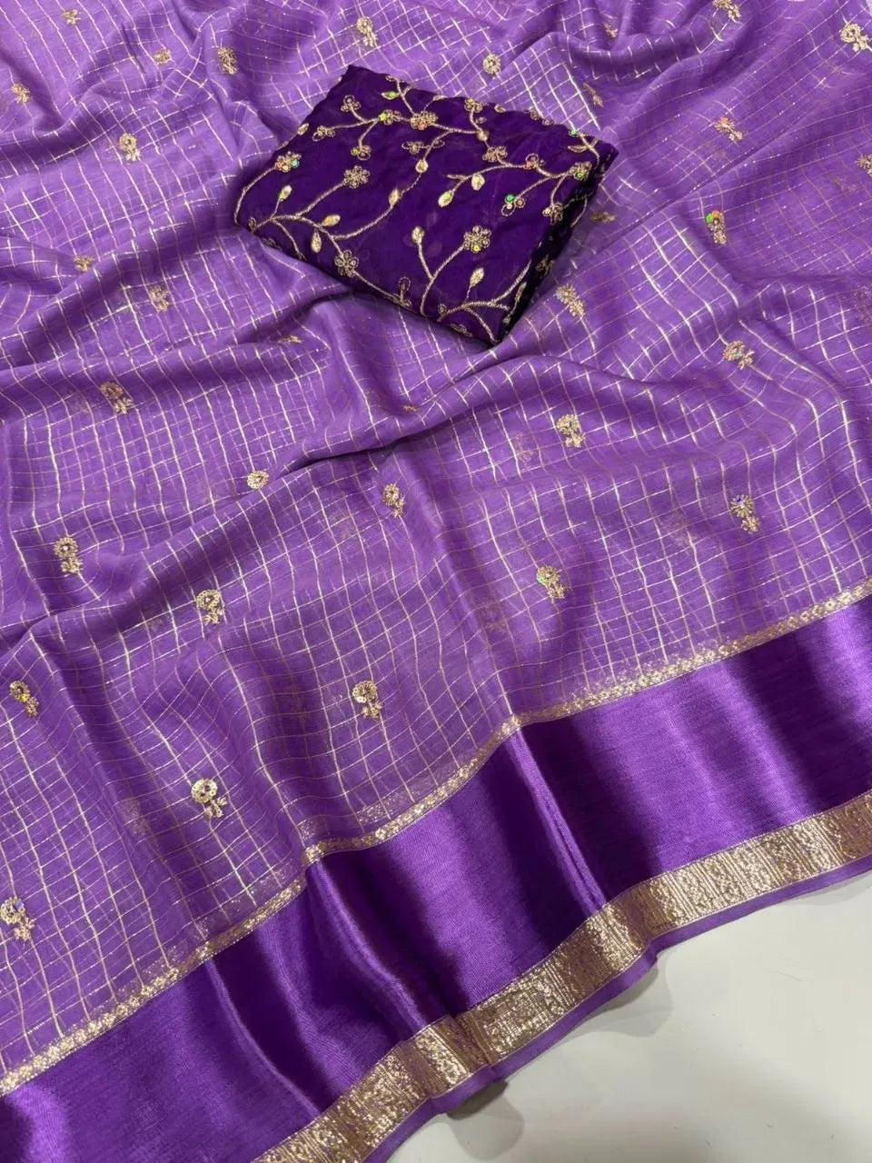 Purple viscose georgette saree featuring delicate sequence motifs