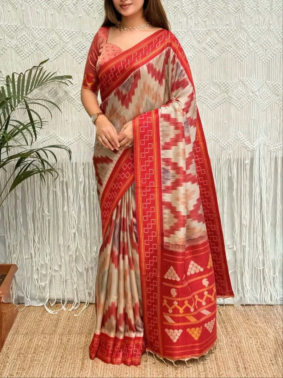 Model wearing red and white viscose silk saree with zari pallu