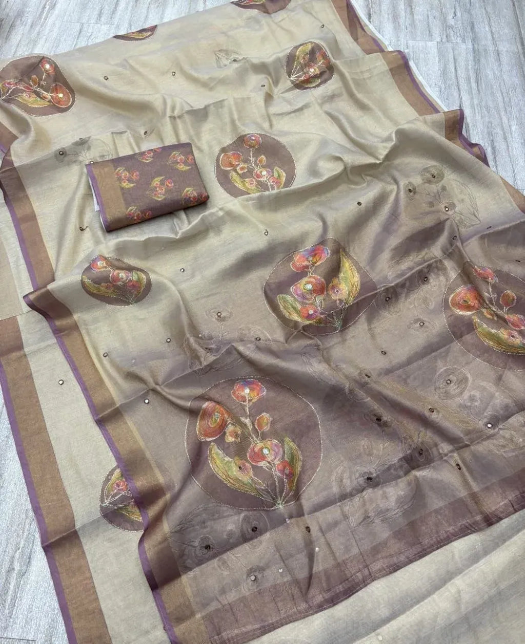Soft zari silk saree with circular floral motifs and matching unstitched blouse piece