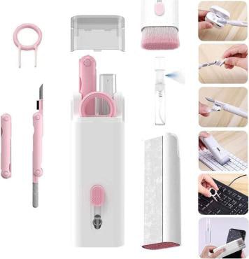 Set of pink and white office supplies including a pen, scissors, and other tools in a white case.