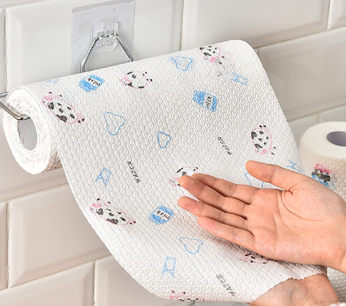 Roll of paper towels with cartoon designs hanging on a rack, with a hand touching it.
