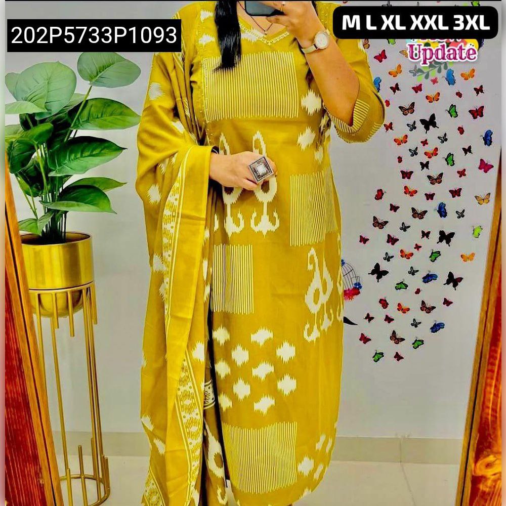 Model wearing a mustard yellow ikat-stripe cotton suit with dupatta