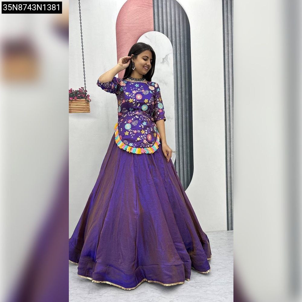 Full body view of a woman showcasing the TRENDBUY Floral Embroidered Fendy Lehenga Set in Lavender, featuring a vibrant floral top and a flared purple lehenga.