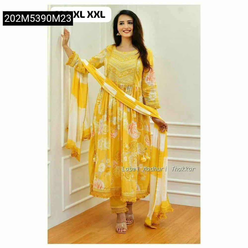 Full shot of model wearing yellow floral embroidered Nyra cut suit set with matching pants and dupatta.