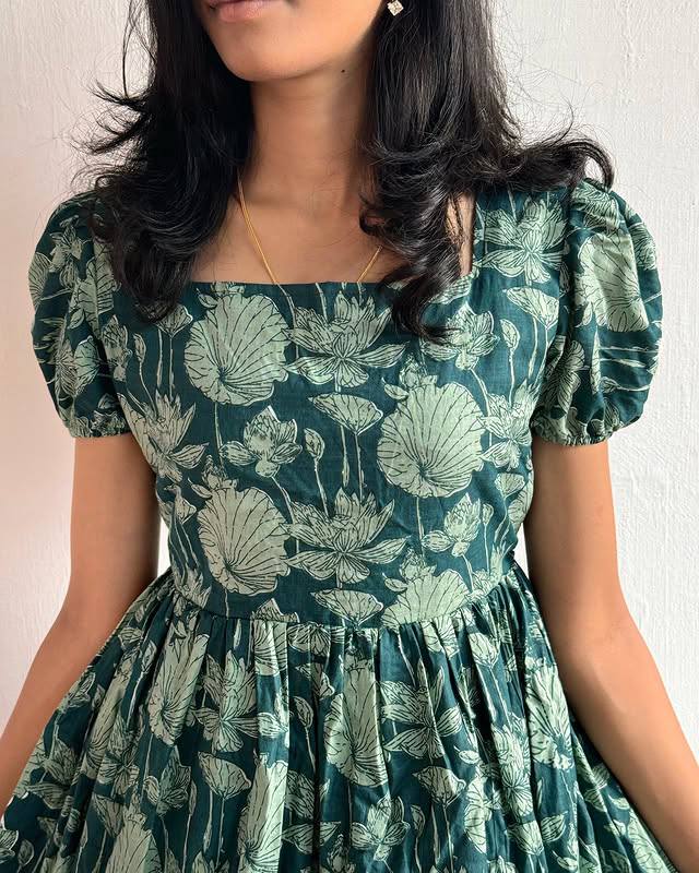 TRENDBUY Green Floral Tiered Midi Dress for women, close-up neckline detail