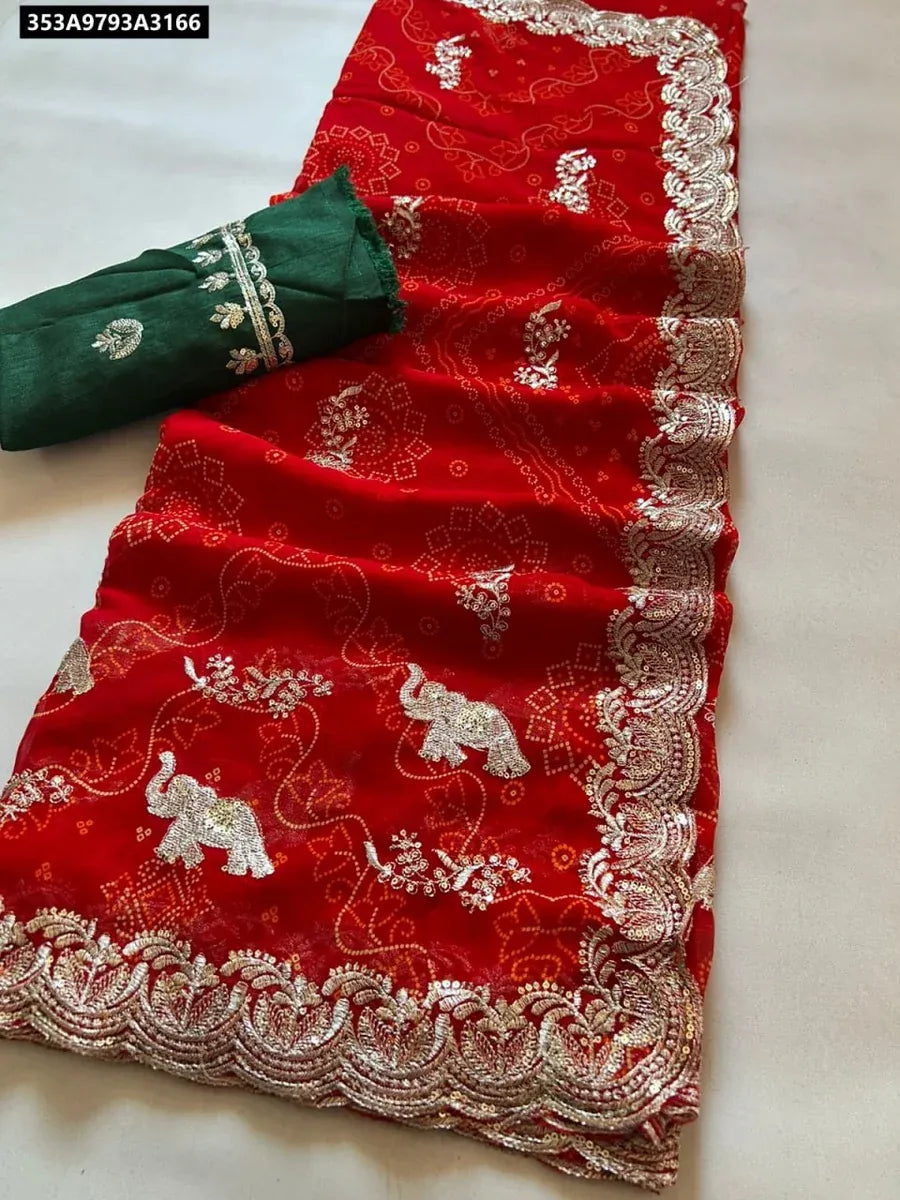 TRENDBUY Georgette Bandhani Saree in Red with Elephant Design and Sequence Work and a Green Unstitched Blouse Piece - Flat Lay