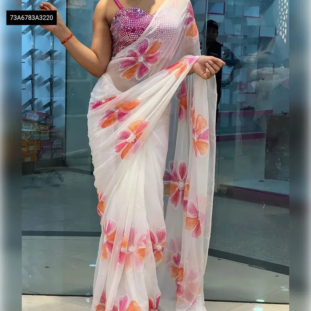 Model wearing a beautiful Pink Georgette digital printed saree with a mirror work blouse.
