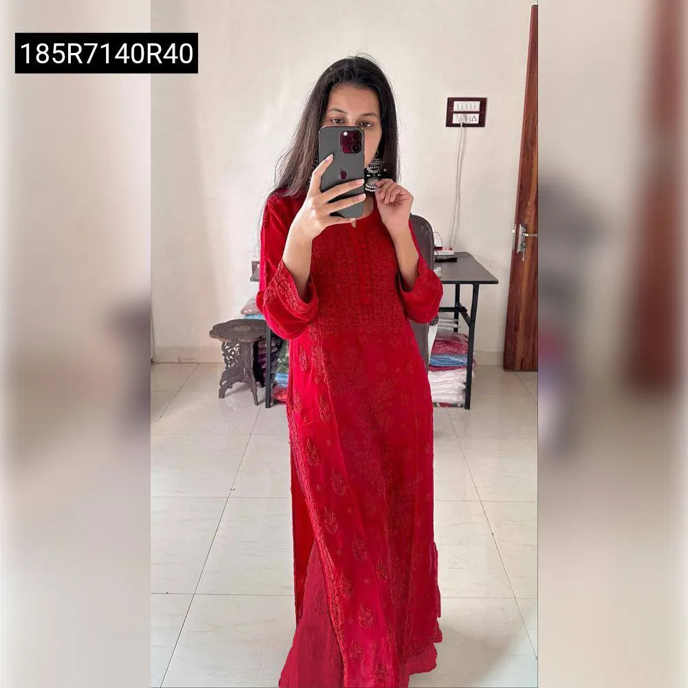 Woman wearing Red Georgette Embroidered Suit in a mirror selfie