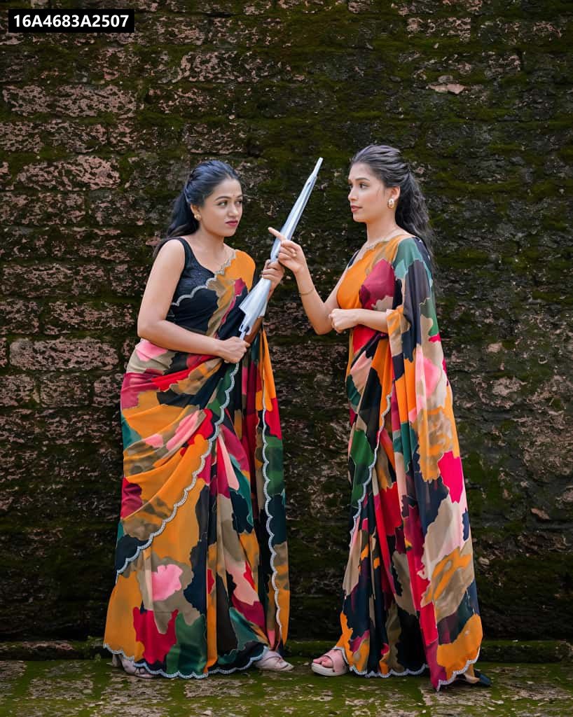 Two women in colorful mosaic digital print georgette sarees posing with umbrellas by a wall.