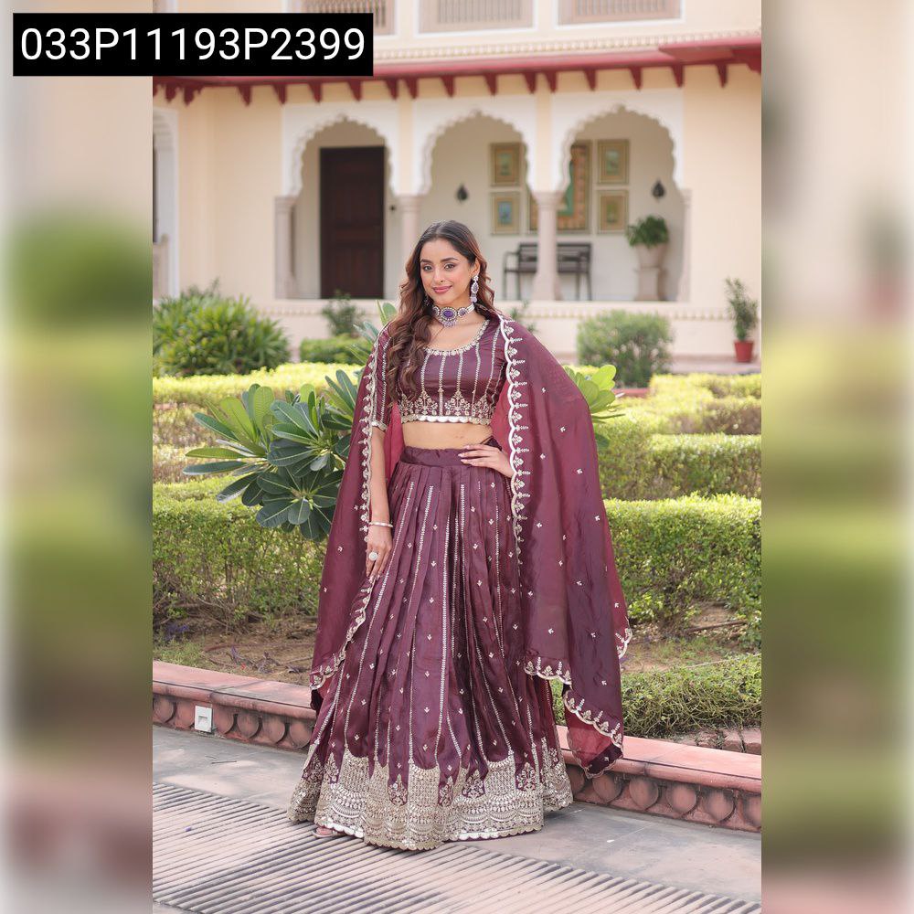 Front view of a model wearing the stunning burgundy Gold Crush embroidered lehenga choli, perfect for festive occasions.