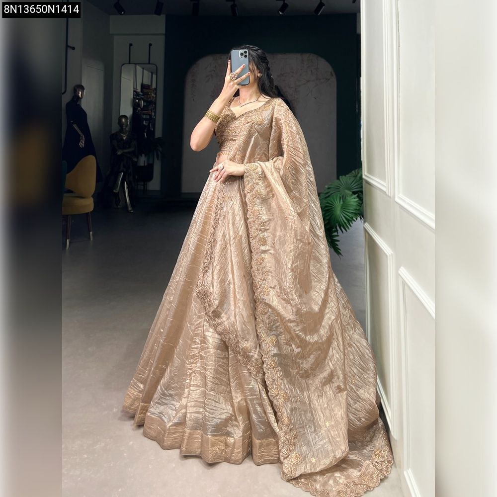 Full view of a model wearing a Gold Crush embroidered lehenga, facing front.