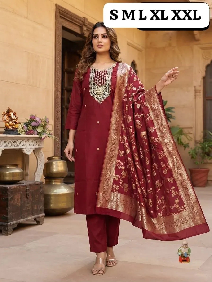 Model wearing maroon festive salwar suit with Banarasi dupatta