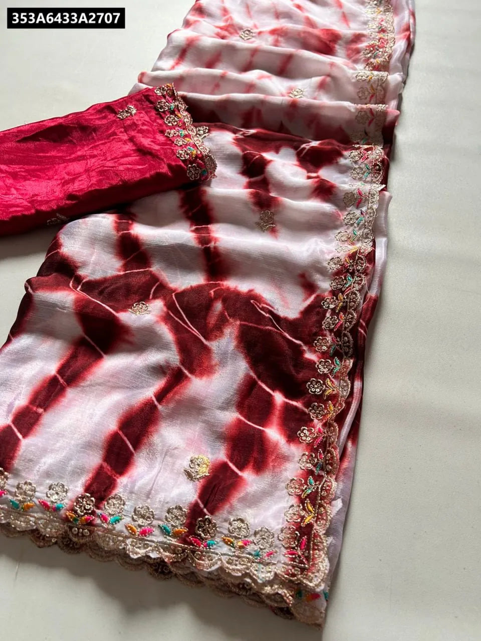 TRENDBUY Hand-Dyed Chinnon Silk Saree in Crimson Tie-Dye with embroidered scalloped border and contrast maroon blouse.
