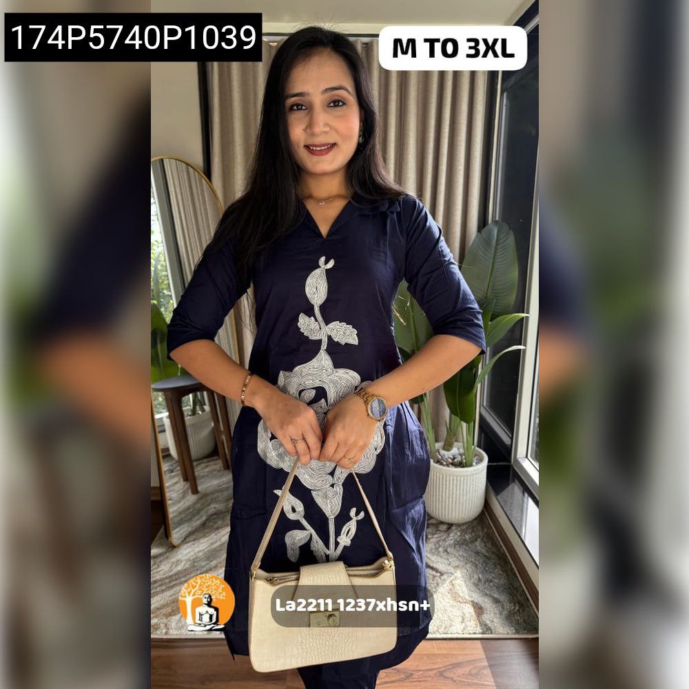 Model in Navy Blue Dhabu Cotton Kurta Pant Set with white floral hand embroidery.