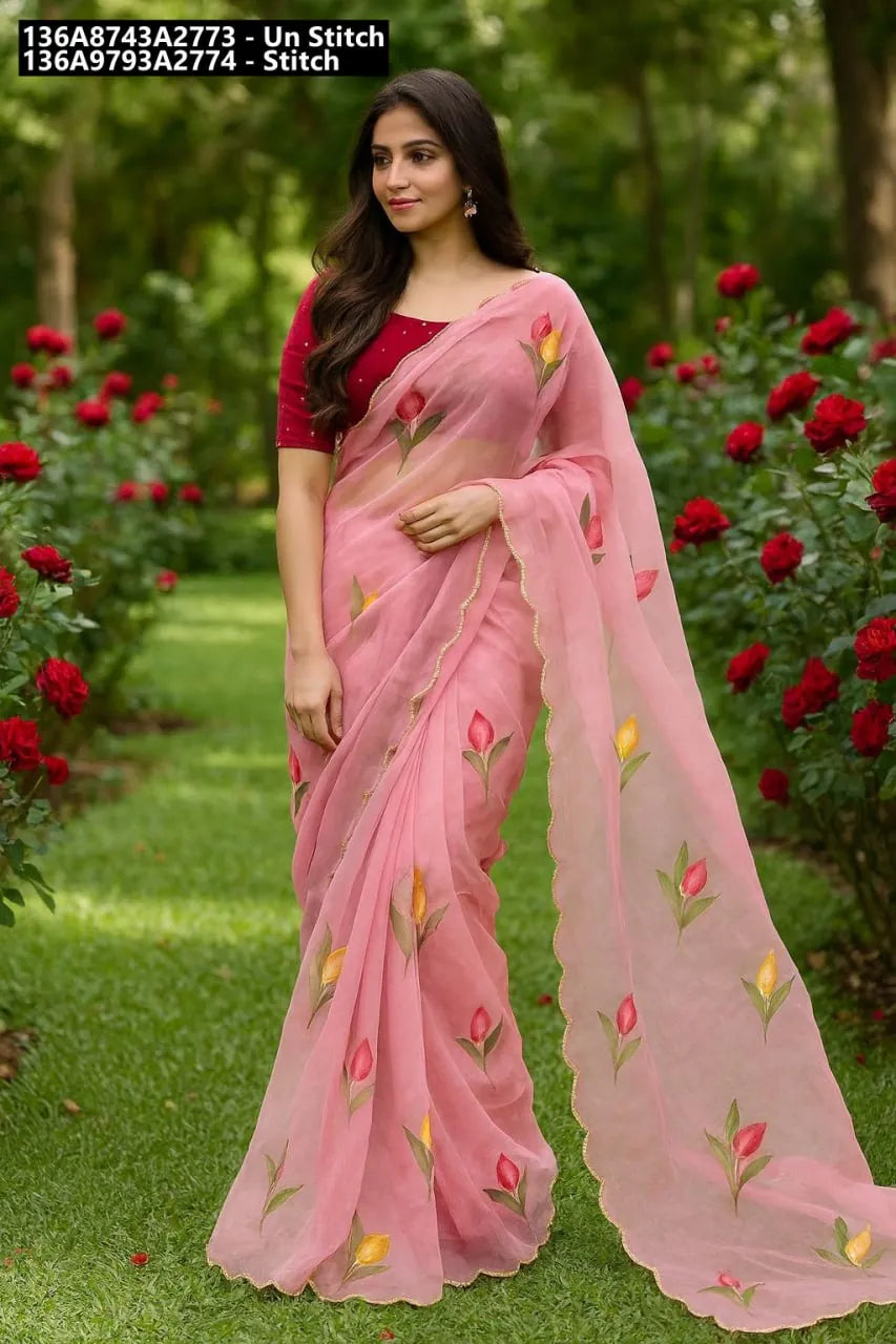 Model showcasing TRENDBUY Pink Chiffon Saree with hand-painted floral motifs and matching blouse in a garden setting