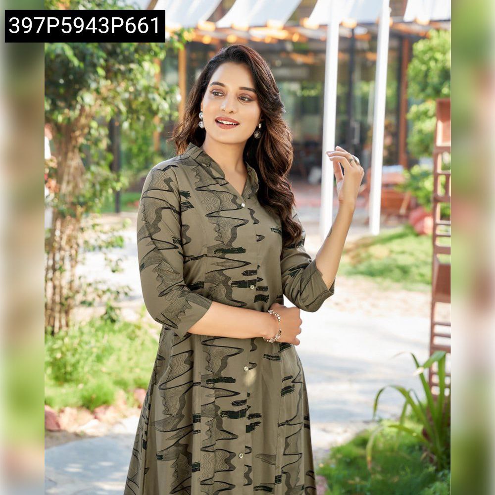 Elegant woman in olive green heavy mill rayon printed kurta and matching pants, smiling gently.
