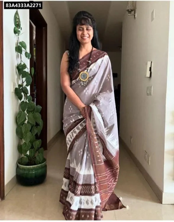 Model wearing TRENDBUY Grey and Brown Ikat Print Linen Saree with matching blouse and ethnic necklace