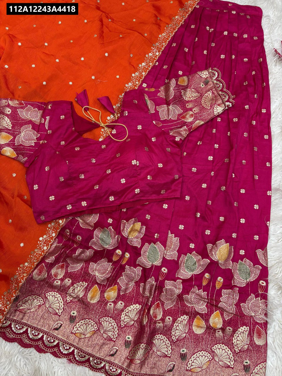 Close-up of the intricate gold jacquard border and delicate fancy cutwork detailing on the hemline.
