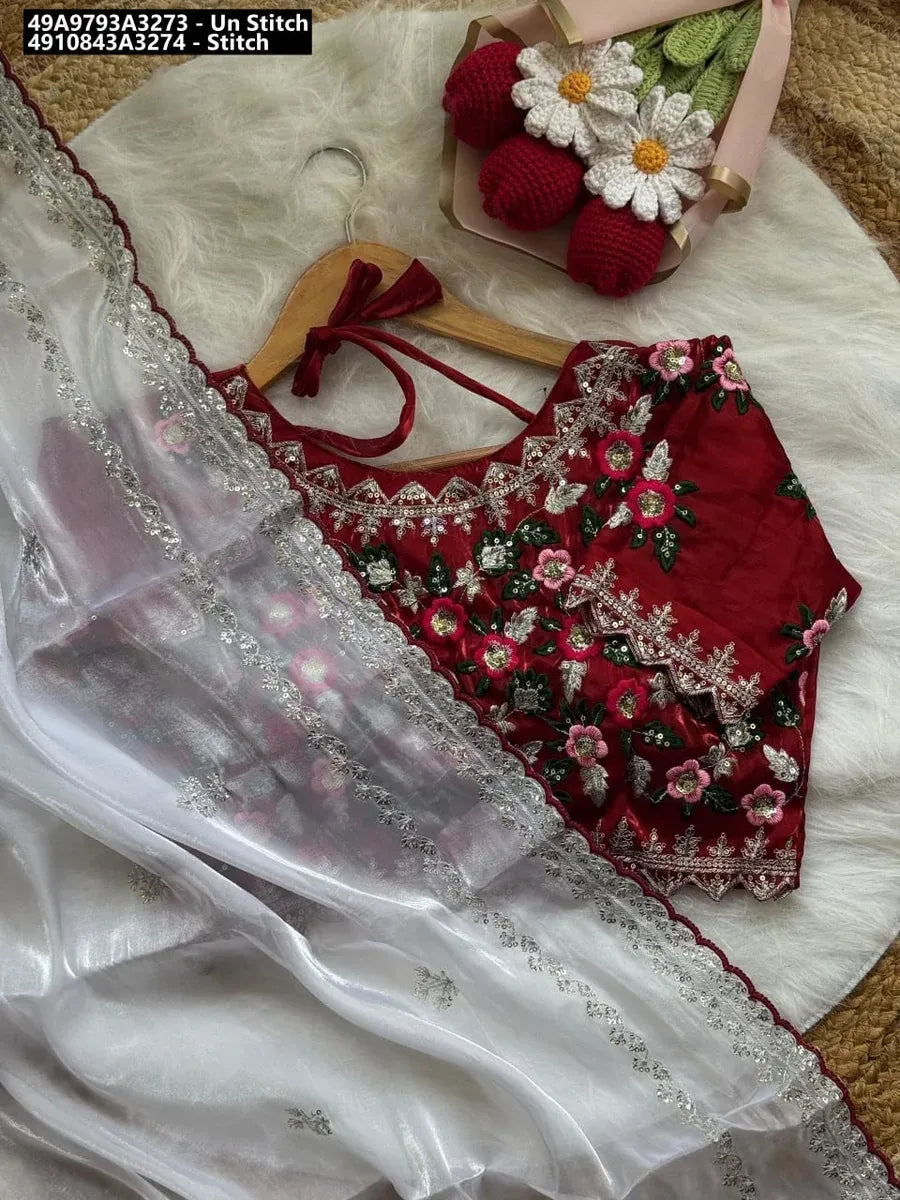 TRENDBUY Crimson & Ivory Jimmy Choo Saree with embroidered blouse, flat lay.
