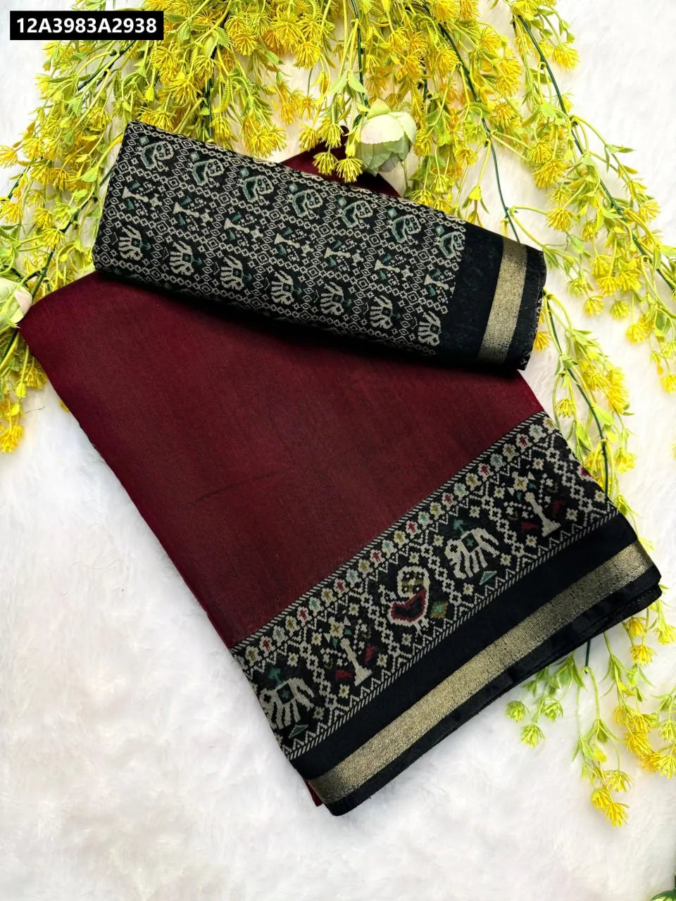TRENDBUY Maroon Mul Mul Cotton Silk Saree with Pen Kalamkari Zari Border and contrast blouse, flat lay