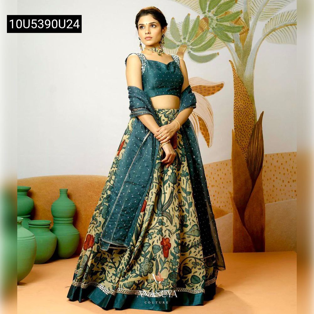 Front view of model wearing a beautiful Kalamkari designer lehenga choli with dupatta, perfect for festive events.