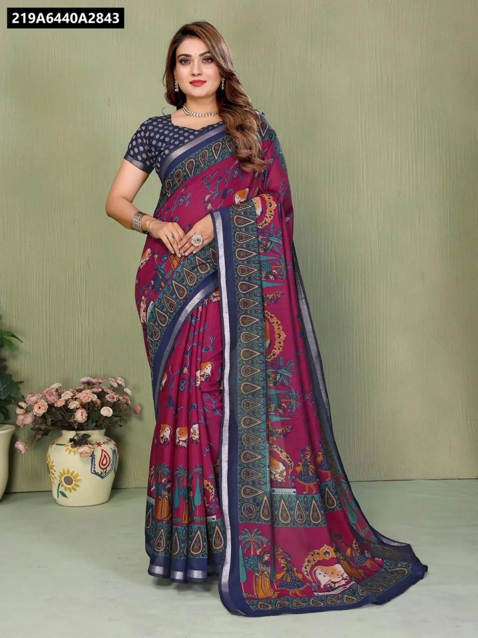 Woman wearing a Berry Mul Cotton Kalamkari Saree with navy blouse.