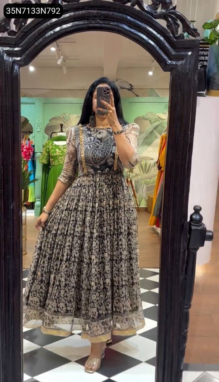 Woman posing in a stunning Kalamkari Print Cota Checks Gown, full body view