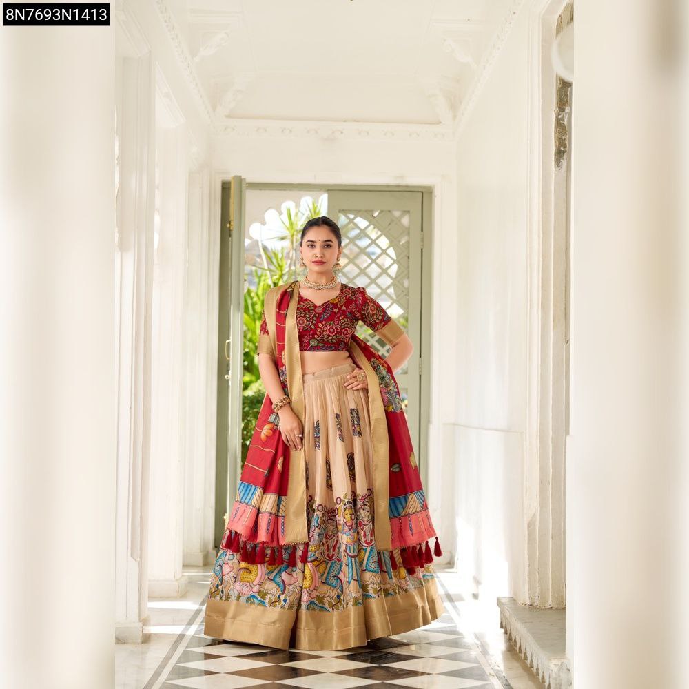 Woman in crimson and beige Kalamkari print Dola Silk lehenga choli, front view, standing elegantly.