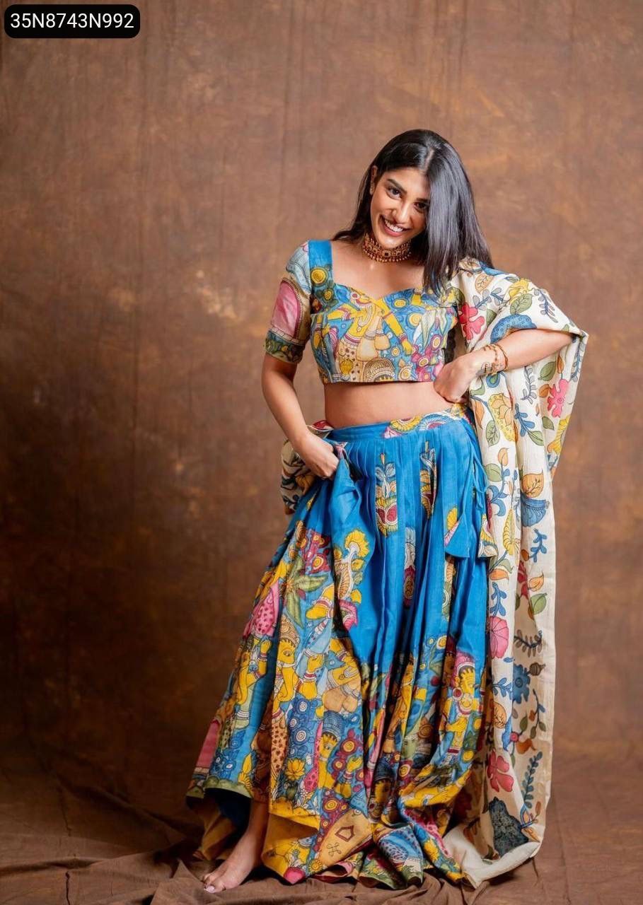 TRENDBUY Kalamkari Print Lehenga Choli Set for Women, Model wearing blue lehenga and multicolor choli, full body front view, smiling