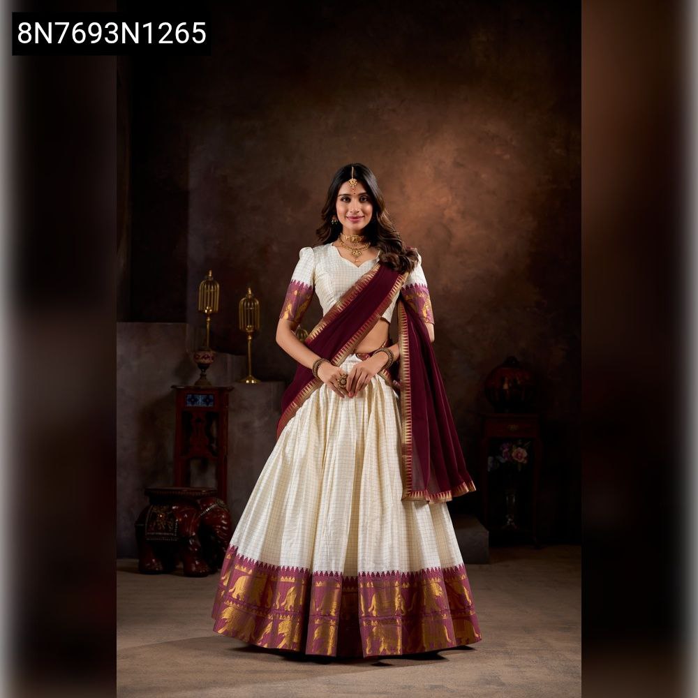 Woman wearing a white Kalyani Cotton Lehenga Choli with maroon dupatta, front view.