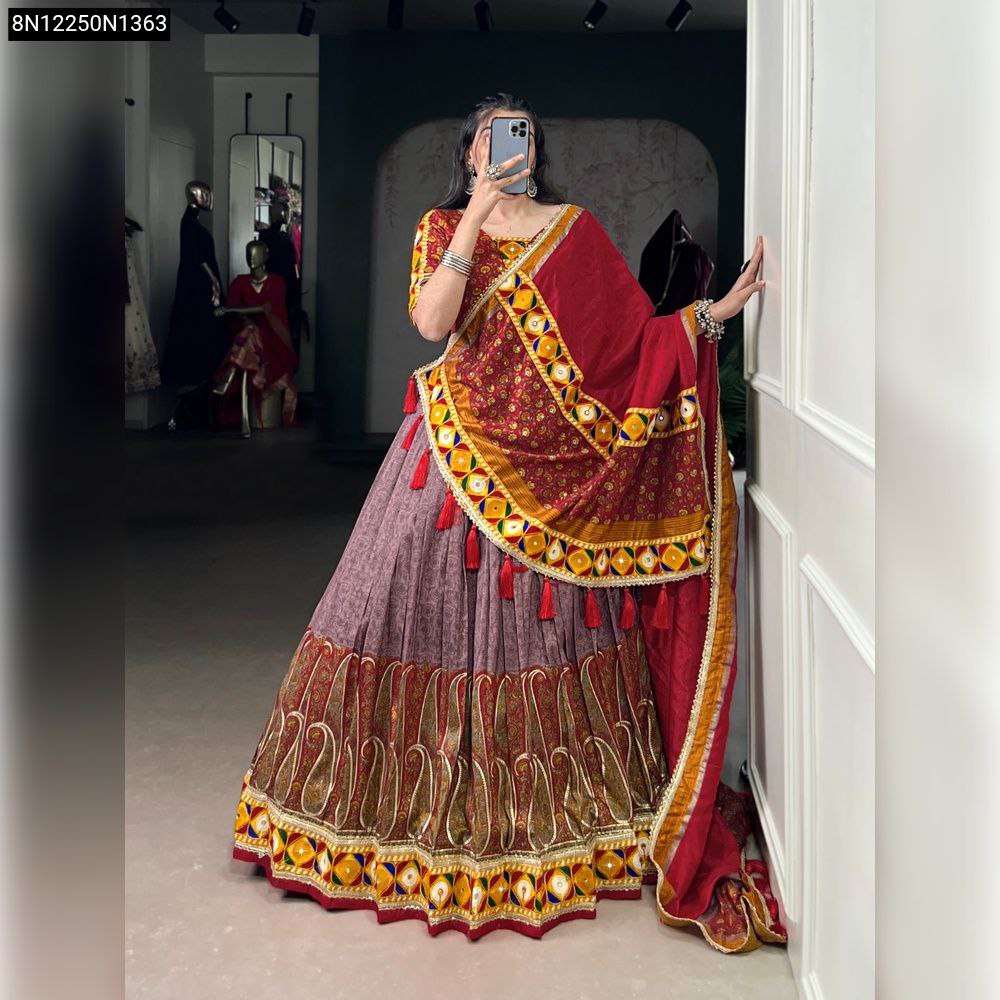 Close-up of original mirror gamthi work and gold foil accents on the blouse neckline