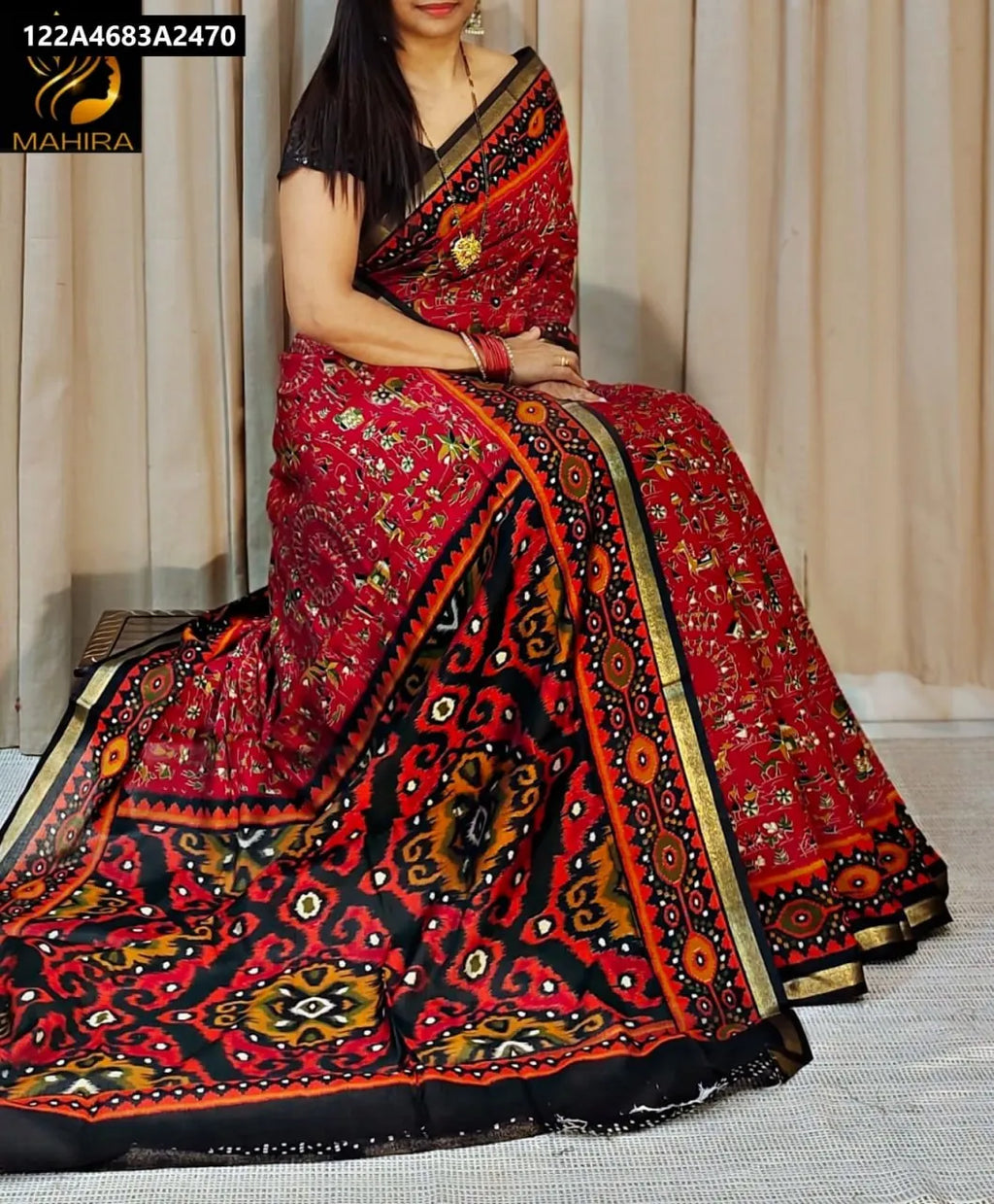 Woman wearing a Crimson Red Katha Silk saree with intricate all-over design, gold zari border, and contrast pallu by TRENDBUY.